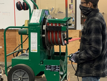 View inside the KDC prefabrication shop of a technician working on a custom project