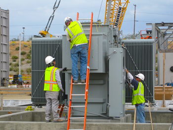 Three KDC electricians working on a commercial electrical construction project